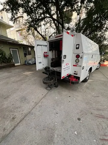 Magnet Plumbing service vehicle on-site for Grease Trap Cleaning in Greater Groves